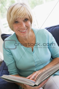 Woman with a book smiling