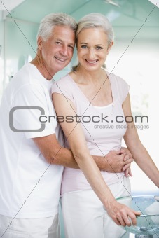 Couple embracing at a spa and smiling