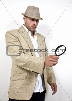 man with fedora hat and magnifier