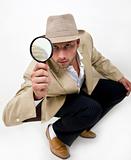 spying man with magnifying glass