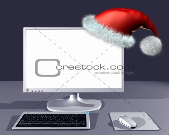 Desktop computer with blank screen and Christmas hat