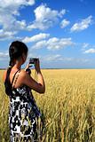 girl photographes the nature