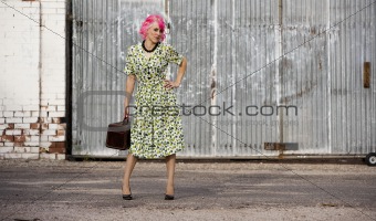 Woman with Pink Hair and a Small Siuitcase