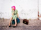 Woman with Pink Hair and a Small Siuitcases
