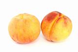 Pair of orange peaches