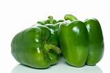 Three green sweet peppers