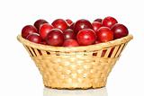 Wicker basket with cherry plums