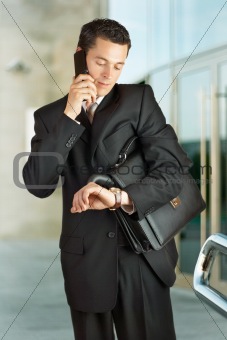 Businessman outside a modern building