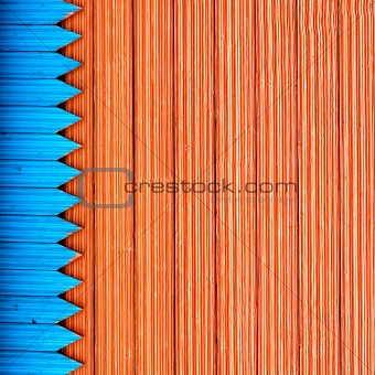 Composition with blue and red structure wooden planks