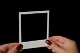 holding blank photo frame