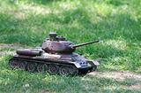 toy tank on green grass