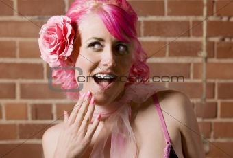 Surprised woman with flower in her hair