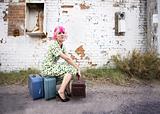 Woman with Pink Hair and a Small Siuitcases