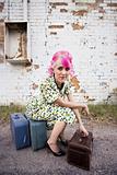 Woman with Pink Hair and a Small Suitcases