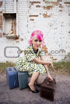 Woman with Pink Hair and a Small Suitcases