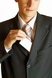 Young businessman holding blank card
