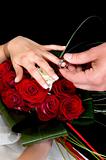 Hands over wedding bouquet