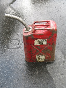 red gas can on the pavement