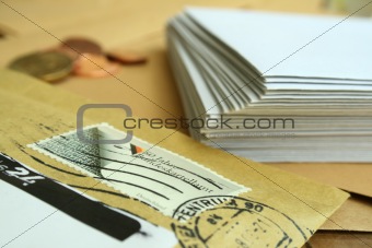 The envelope with the stamp and the white envelopes