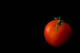 Tomato on a black background