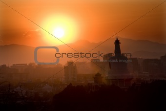 Beihai Stupa with Sunset and Mountains Beijing China