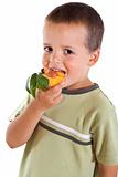 Boy eating peach