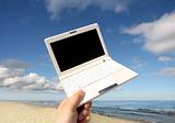 White small  Laptop on the beach