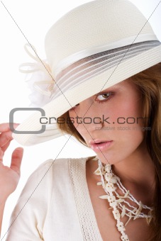 Young pretty woman in a white hat