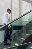 Businessman ascending stairs
