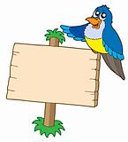 Wooden sign with blue bird