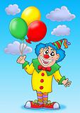 Clown with balloons on blue sky