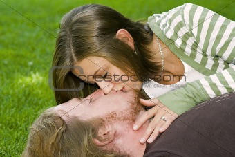 Young couple kissing in the Park