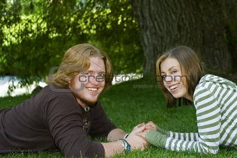 Young couple holding hands in the Park