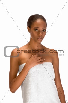 Afro-American girl wrapped in white bath towel