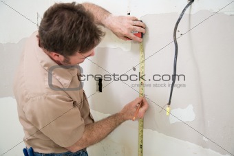 Worker Measuring and Marking