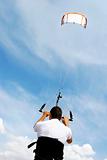 kitesurfer and his kite at sky background