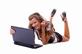 Beautiful sexy woman with a laptop lying on floor. 
