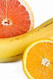 Orange, grapefruit and banana close up