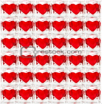 Background made of glass tiles with red hearts