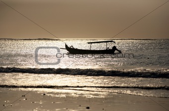 Drifting boat on a sunset