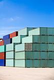 shipping containers against blue sky