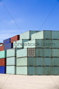 shipping containers against blue sky