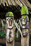 Two wooden totems (idols) near african village