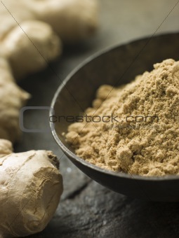 Dish of Ginger Powder with Fresh Ginger Root