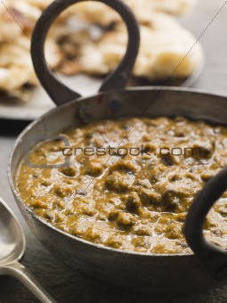 Kali Dahl Served in a Karahi With Naan Bread