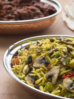 Dish of Mushroom Pilau Rice with Beef Madras
