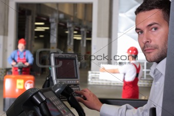 operator working with control panel in warehouse