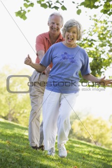 Senior couple having fun in park