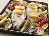 Whole Sea Bass Roasted with Fennel Lemon Garlic and Cherry Tomat