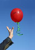Flying red balloon with the words I love you